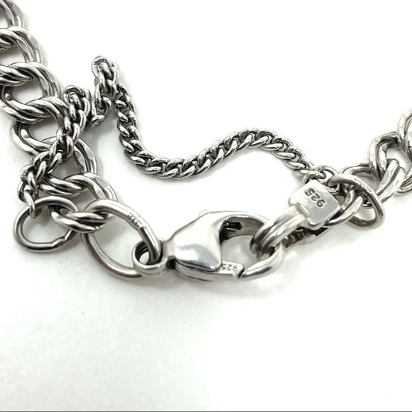 JAMES AVERY sterling silver charm bracelet, 8 charms Bracelets